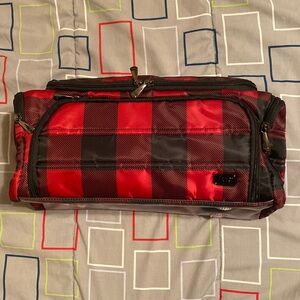 Lug Trolley Xl red buffalo checkered traveling bag.